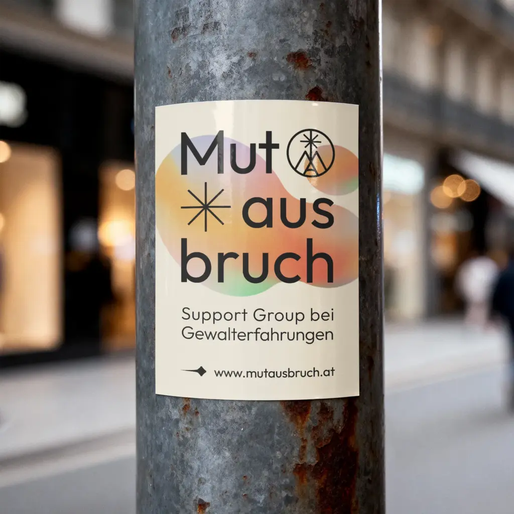 Mutausbruch Sticker auf einem Straßenpfosten
